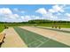 Enjoy a game of shuffleboard outdoors at 16340 Treasure Point Dr, Wimauma, FL 33598