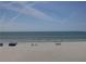 Expansive beach view with people enjoying the day at 20040 Gulf Blvd # 302, Indian Shores, FL 33785