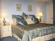 Main bedroom with a king-size bed and elegant decor at 20040 Gulf Blvd # 302, Indian Shores, FL 33785