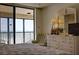 Bedroom with ocean view and dresser at 20040 Gulf Blvd # 302, Indian Shores, FL 33785