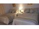 Guest bedroom with two twin-size beds at 20040 Gulf Blvd # 302, Indian Shores, FL 33785