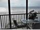Stunning ocean view from private balcony, featuring table and chairs at 20040 Gulf Blvd # 302, Indian Shores, FL 33785