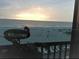 Stunning sunrise over the ocean from private balcony at 20040 Gulf Blvd # 302, Indian Shores, FL 33785