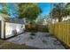 Small backyard with shed, gravel ground cover, and wooden fence at 2942 24Th N Ave, St Petersburg, FL 33713