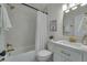 Updated bathroom with white vanity and gold fixtures at 2942 24Th N Ave, St Petersburg, FL 33713