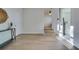 Bright hallway with light wood flooring, leading to bedrooms and laundry at 2942 24Th N Ave, St Petersburg, FL 33713