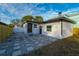 Back exterior of house with patio and fenced yard at 2942 24Th N Ave, St Petersburg, FL 33713
