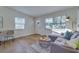 Light-filled living area with gray sectional and wood-look floors at 2942 24Th N Ave, St Petersburg, FL 33713