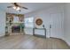 Living room with stone fireplace and wood-look floors at 2942 24Th N Ave, St Petersburg, FL 33713