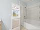 Clean bathroom with bathtub and view of bedroom at 3117 Bayshore Oaks Dr, Tampa, FL 33611
