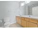 Bathroom boasts double sinks and light wood cabinets at 3117 Bayshore Oaks Dr, Tampa, FL 33611