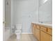 Bathroom with double vanity and tiled shower at 3117 Bayshore Oaks Dr, Tampa, FL 33611