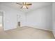 Bedroom with ceiling fan and access to bathroom at 3117 Bayshore Oaks Dr, Tampa, FL 33611