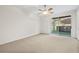 Spacious bedroom with carpet flooring and sliding glass doors at 3117 Bayshore Oaks Dr, Tampa, FL 33611