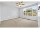 Spacious bedroom with carpeted floors and large window at 3117 Bayshore Oaks Dr, Tampa, FL 33611