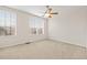 Bright bedroom with neutral walls and carpet at 3117 Bayshore Oaks Dr, Tampa, FL 33611