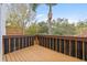 Private deck with wooden flooring and string lights at 3117 Bayshore Oaks Dr, Tampa, FL 33611