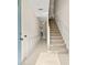 Bright and airy entryway with tiled floors and staircase at 3117 Bayshore Oaks Dr, Tampa, FL 33611