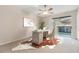 Bright home office with hardwood desk and cowhide rug at 3117 Bayshore Oaks Dr, Tampa, FL 33611