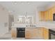 Kitchen with a view of the living room and upper level at 3117 Bayshore Oaks Dr, Tampa, FL 33611