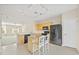 Modern kitchen with light wood cabinets and a breakfast bar at 3117 Bayshore Oaks Dr, Tampa, FL 33611