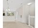 Spacious living area with a view of the kitchen and staircase at 3117 Bayshore Oaks Dr, Tampa, FL 33611
