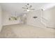 Spacious living room with neutral carpeting and ceiling fan at 3117 Bayshore Oaks Dr, Tampa, FL 33611