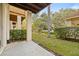 Private patio with view of grassy backyard at 3117 Bayshore Oaks Dr, Tampa, FL 33611