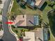 Home boasts a private pool, easily seen in this overhead view at 3621 Darston St, Palm Harbor, FL 34685