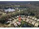 Aerial view showing home's location in a quiet community by a lake at 3621 Darston St, Palm Harbor, FL 34685