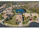 Community overview featuring houses, lush greenery, and a serene lake at 3621 Darston St, Palm Harbor, FL 34685