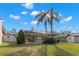 Spacious backyard with screened pool and lush landscaping at 3621 Darston St, Palm Harbor, FL 34685