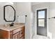 Bathroom with walk-in shower and updated vanity at 3621 Darston St, Palm Harbor, FL 34685