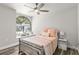 Charming bedroom with a full bed and window seat at 3621 Darston St, Palm Harbor, FL 34685