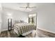 Spacious bedroom with a queen bed and backyard access at 3621 Darston St, Palm Harbor, FL 34685