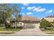 Single-story home with a two-car garage and well-maintained landscaping at 3621 Darston St, Palm Harbor, FL 34685
