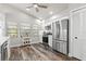 Modern kitchen with stainless steel appliances and white shaker cabinets at 3621 Darston St, Palm Harbor, FL 34685