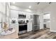 Updated kitchen features stainless steel appliances and white cabinets at 3621 Darston St, Palm Harbor, FL 34685