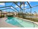 Enjoy this refreshing screened pool with picturesque lake views at 3621 Darston St, Palm Harbor, FL 34685