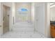 Bathroom with soaking tub, shower, and tile flooring at 3702 Gaviota Dr, Ruskin, FL 33573