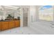 Main bathroom with granite vanity, shower, and tub at 3702 Gaviota Dr, Ruskin, FL 33573