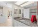 Bathroom with granite countertop and access to kitchen at 3702 Gaviota Dr, Ruskin, FL 33573
