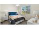 Guest bedroom with window, ceiling fan, and nightstands at 3702 Gaviota Dr, Ruskin, FL 33573