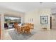 Charming dining room with wood table and access to backyard at 3702 Gaviota Dr, Ruskin, FL 33573