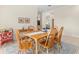 Bright dining room featuring a wood table with six chairs and decorative accents at 3702 Gaviota Dr, Ruskin, FL 33573