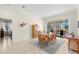 Bright dining room with wooden table and view of pool area at 3702 Gaviota Dr, Ruskin, FL 33573