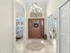 Bright and spacious entryway with tile floors and a chandelier at 3702 Gaviota Dr, Ruskin, FL 33573