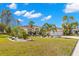 Single story house with palm trees and a two-car garage at 3702 Gaviota Dr, Ruskin, FL 33573