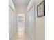Bright hallway with tile floors and access to bathroom and closets at 3702 Gaviota Dr, Ruskin, FL 33573