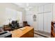 Bright home office features built-in shelving and comfortable seating at 3702 Gaviota Dr, Ruskin, FL 33573